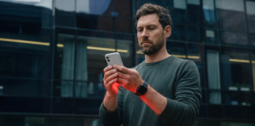 Cell phone EMF radiation causing heat buildup in hands — visual representation of mobile phone heating effects on the body